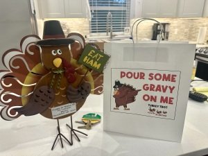 Poultry in Motion; Waco Thanksgiving Day Turkey Trot 5K and 1K Run/Walk Logo