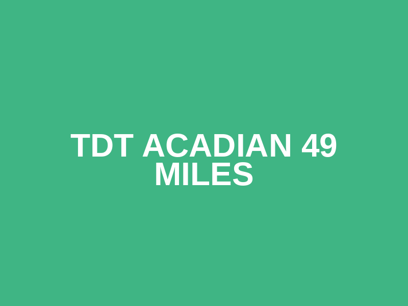 TDT ACADIAN 49 MILES Logo